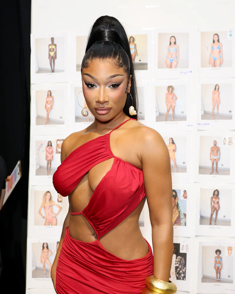 Megan Thee Stallion backstage at the Hot Girl Summer show with a snatched ponytail and eyeliner