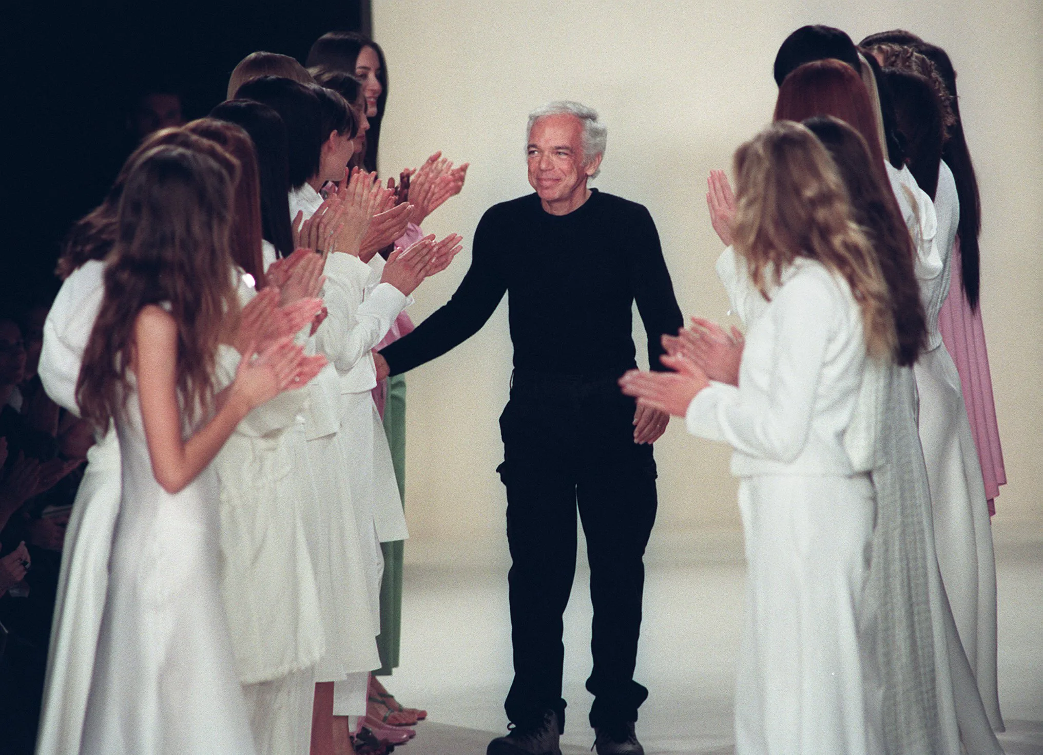 Designer Ralph Lauren (C) receives applause from models after his fashion show 04 November in New Yo...