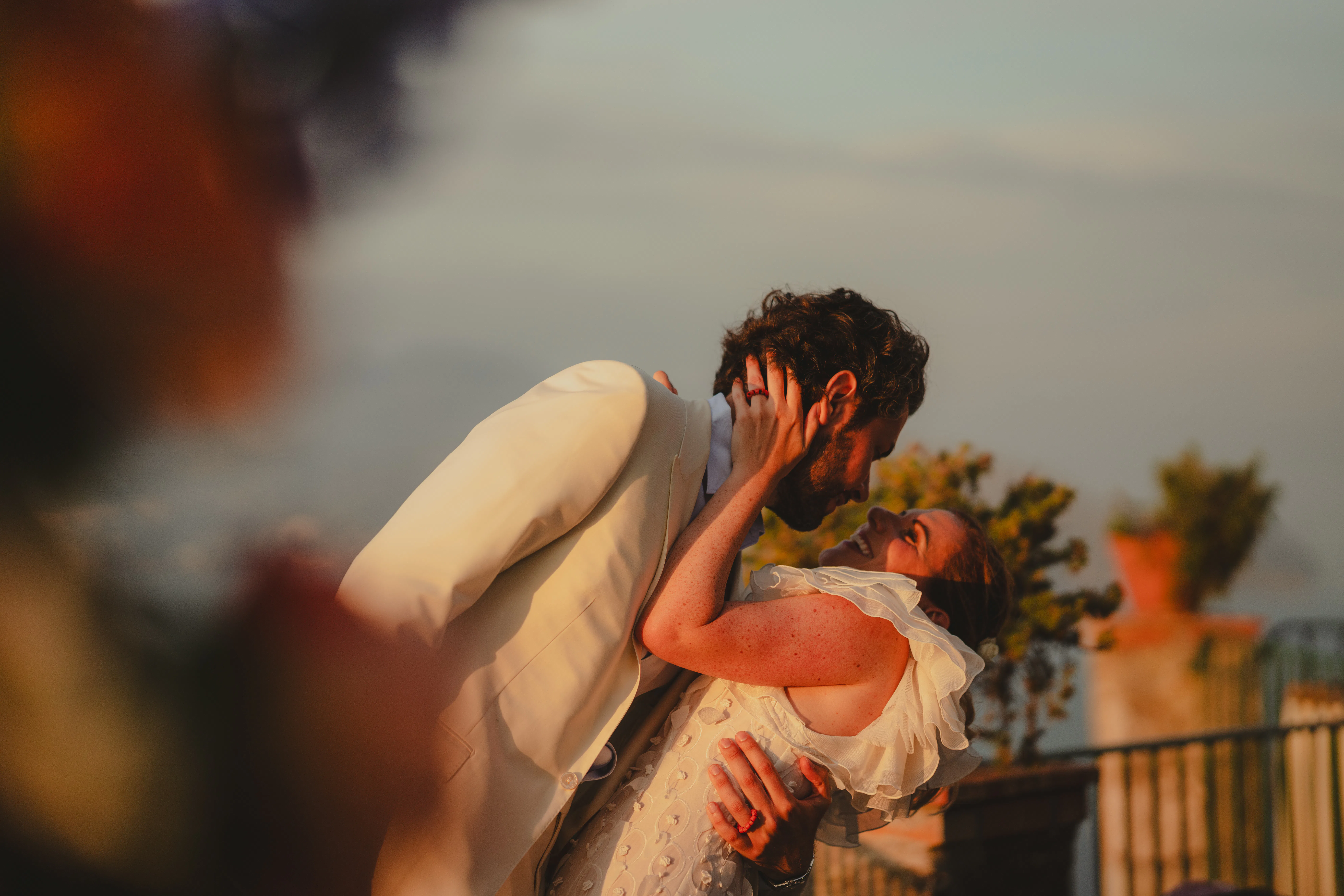 Beatiful couple, formalwear. Seascape in background