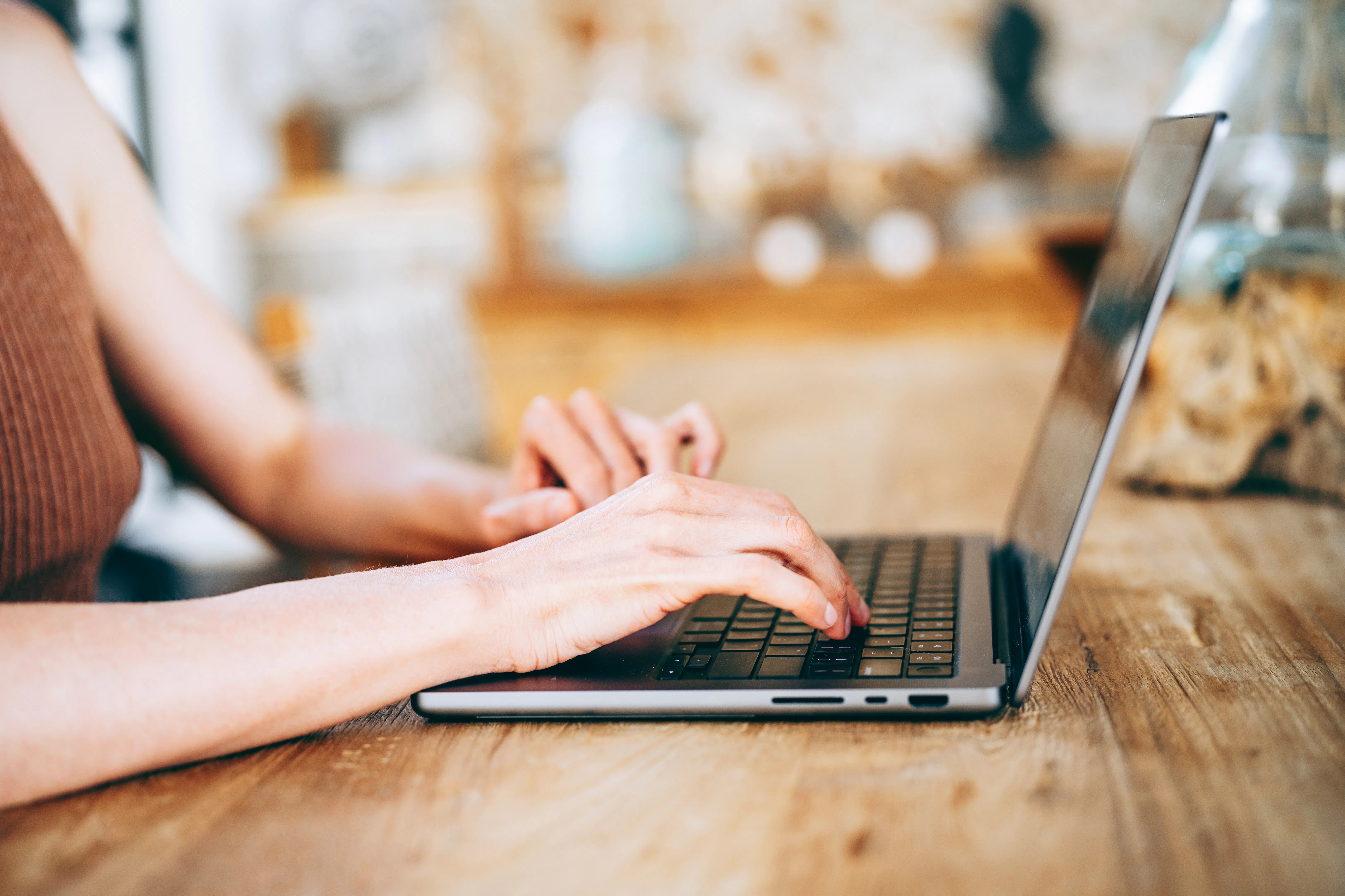 woman typing on laptop