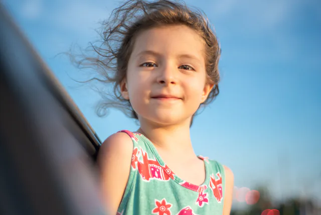 Preschool age Caucasian little girl looking at camera with confidence.