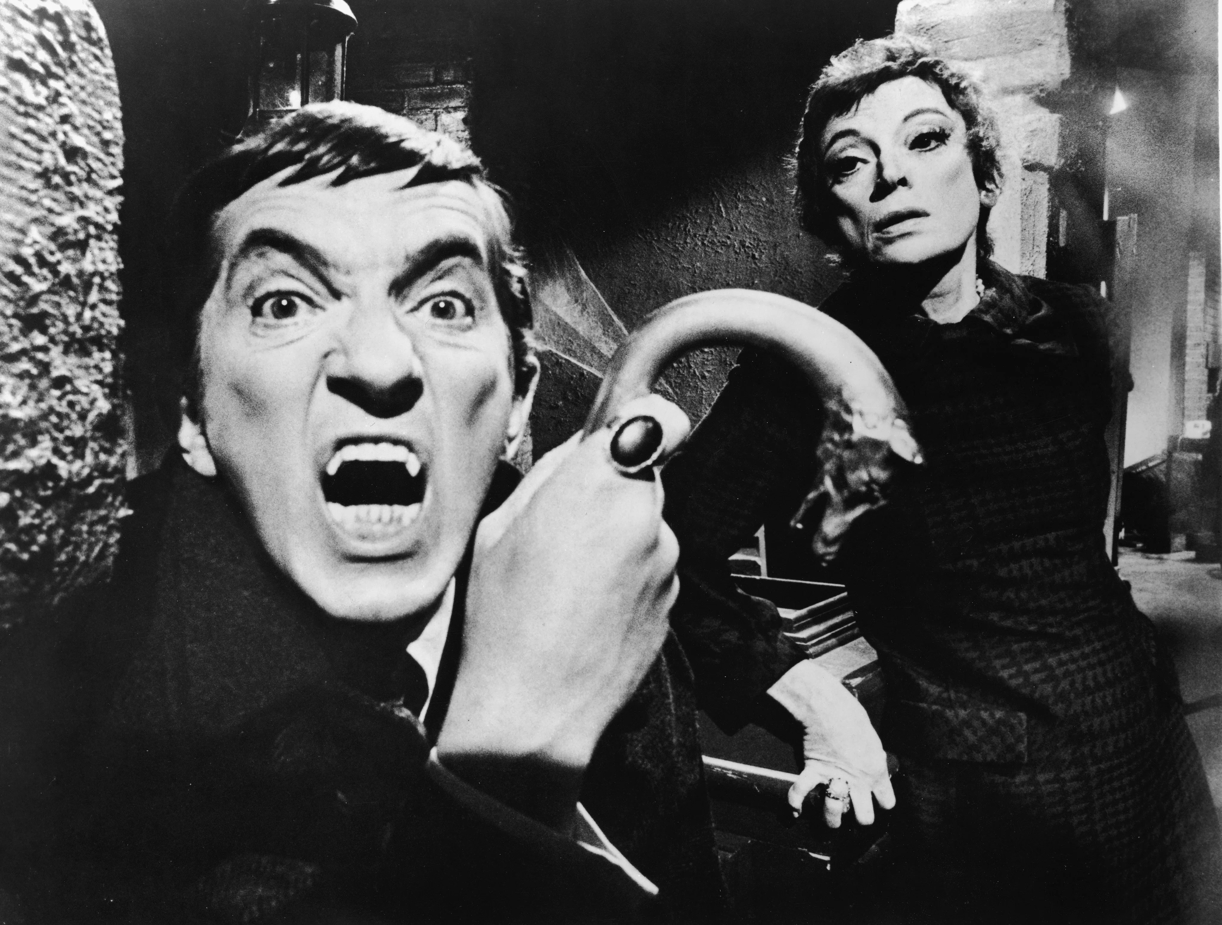 Publicity portrait of Canadian actor Jonathon Frid, a metal-tipped cane in his hand as he bares his ...