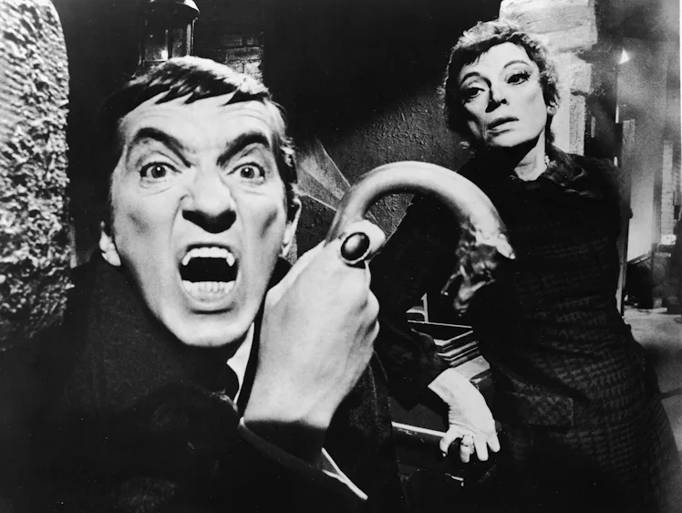 Publicity portrait of Canadian actor Jonathon Frid, a metal-tipped cane in his hand as he bares his ...
