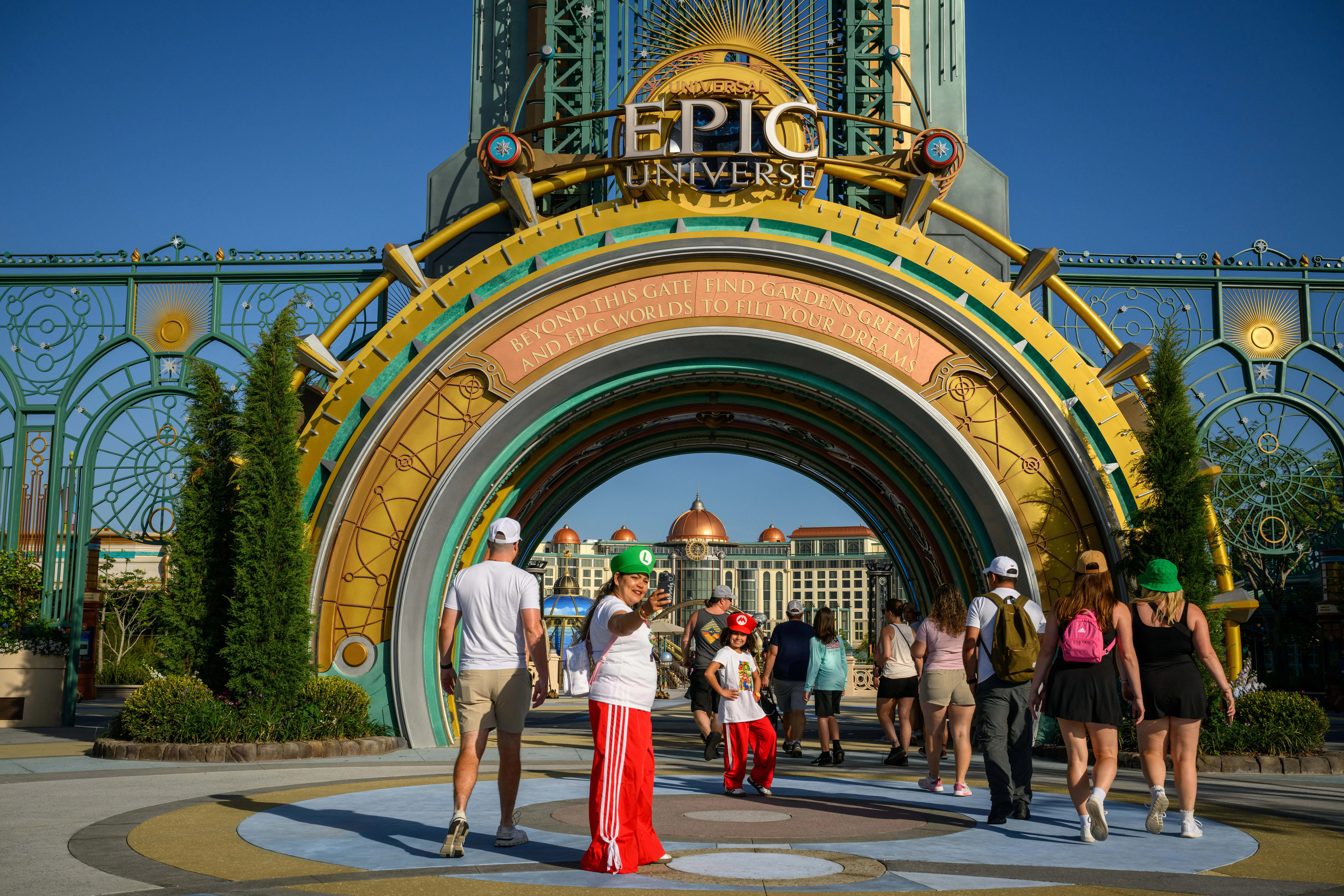 Guests arrive at the entrance portal to the Epic Universe theme park in Orlando, Florida, US, on Sat...