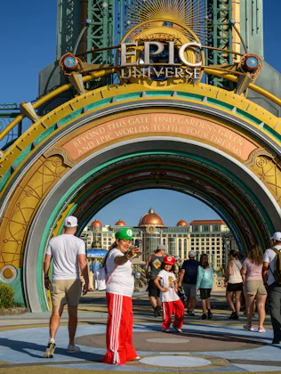 Guests arrive at the entrance portal to the Epic Universe theme park in Orlando, Florida, US, on Sat...