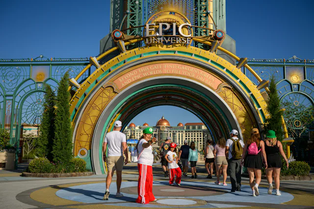 Guests arrive at the entrance portal to the Epic Universe theme park in Orlando, Florida, US, on Sat...
