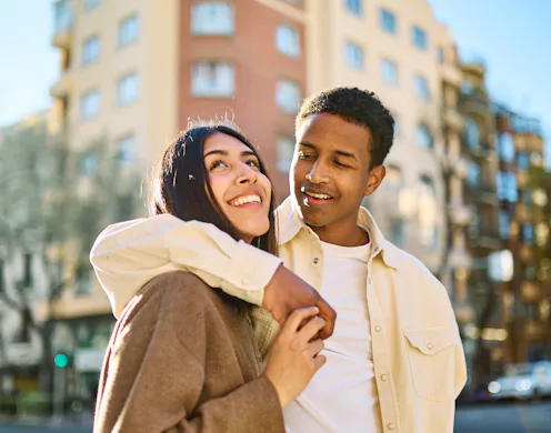 Portrait of a smiling couple in the city, tourists visiting destination, summer trip exploring, beau...