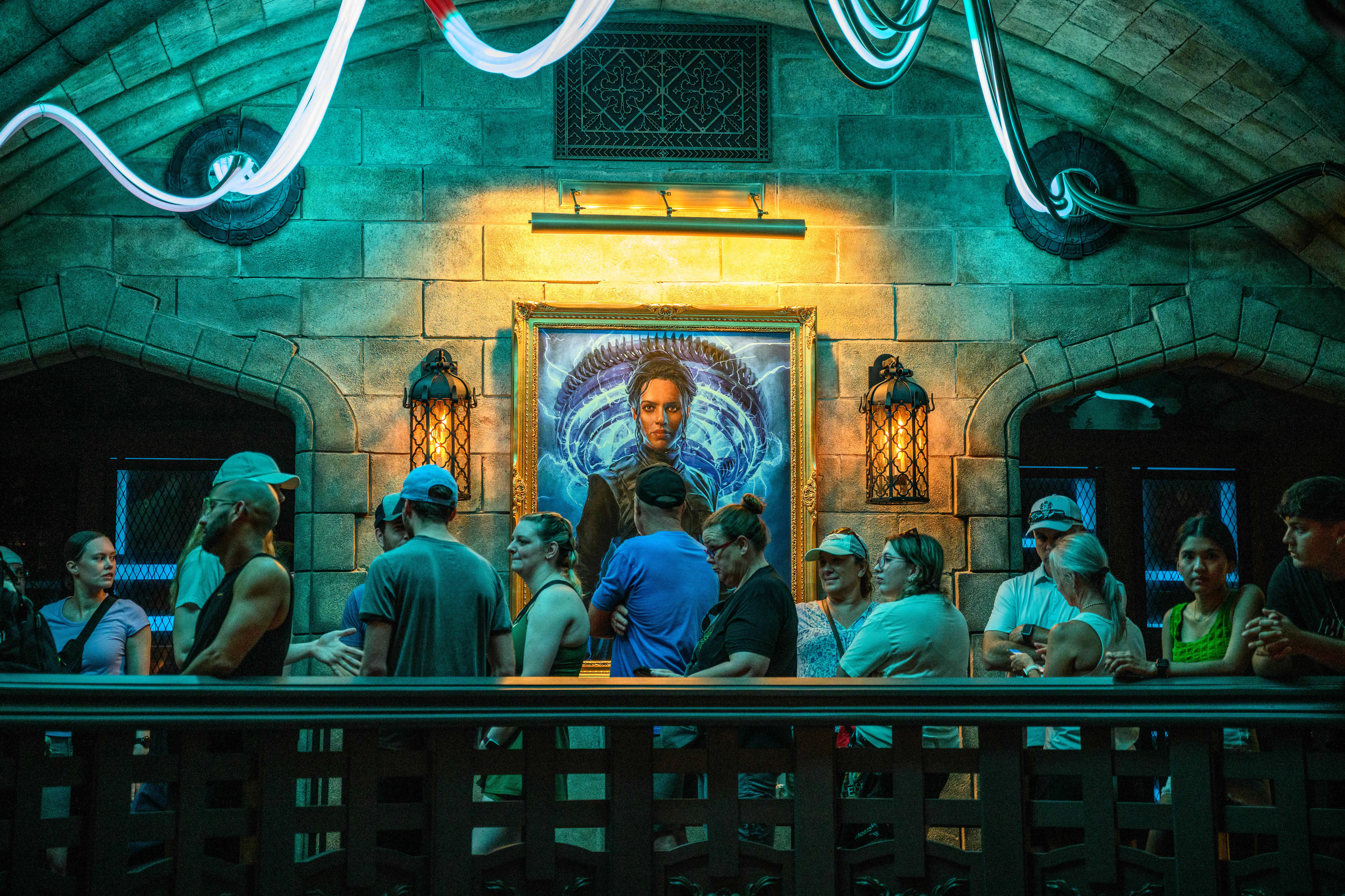 Guest wait in line for the Monsters Unchained: The Frankenstein Experiment amusement ride in the Dar...