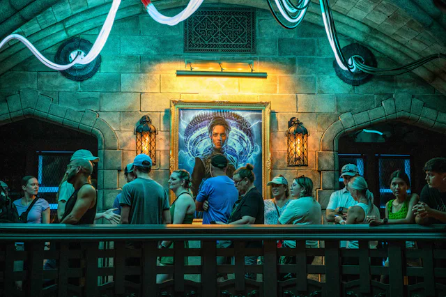 Guest wait in line for the Monsters Unchained: The Frankenstein Experiment amusement ride in the Dar...