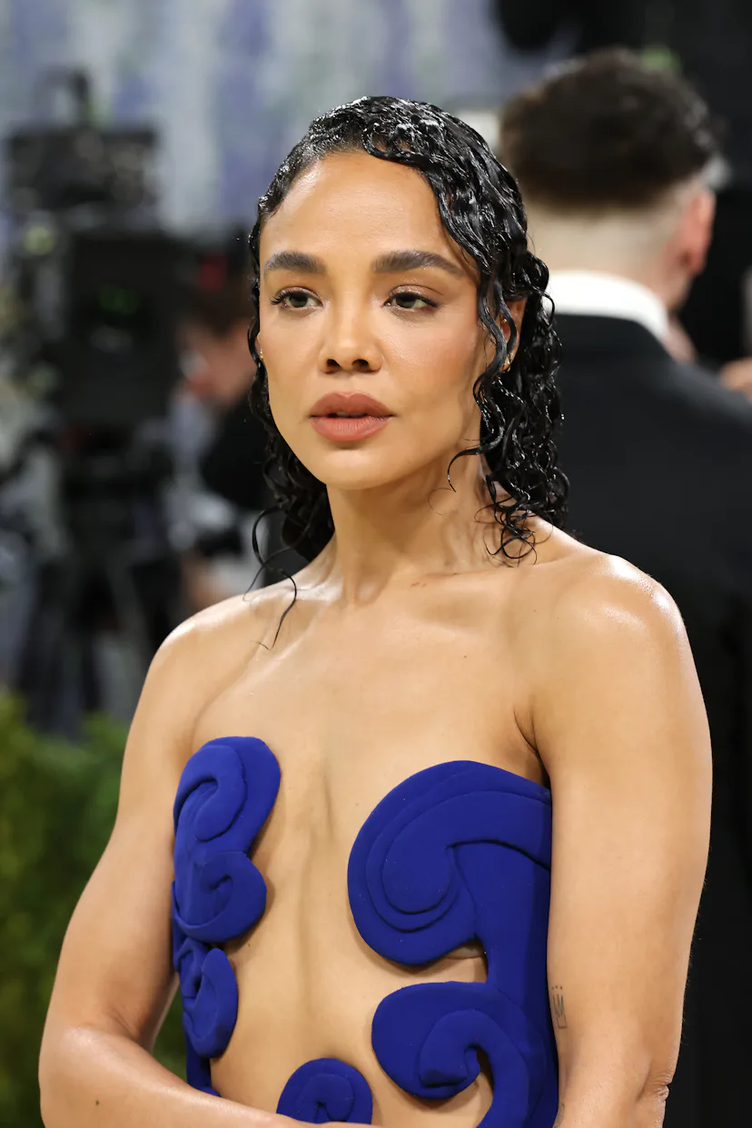 Tessa Thompson with wet-looking sculpted curls at the 2026 Met Gala