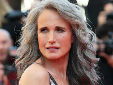 Andie MacDowell at the Cannes Film Festival with long gray hair in a glam blowout