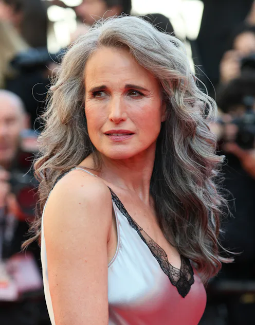 Andie MacDowell at the Cannes Film Festival with long gray hair in a glam blowout