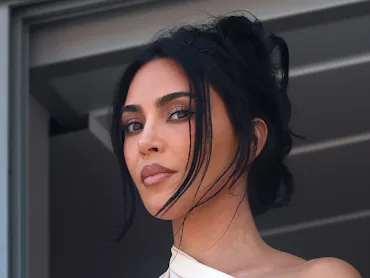 Kim Kardashian explained why she posted lake party pics after her grandma MJ's death.