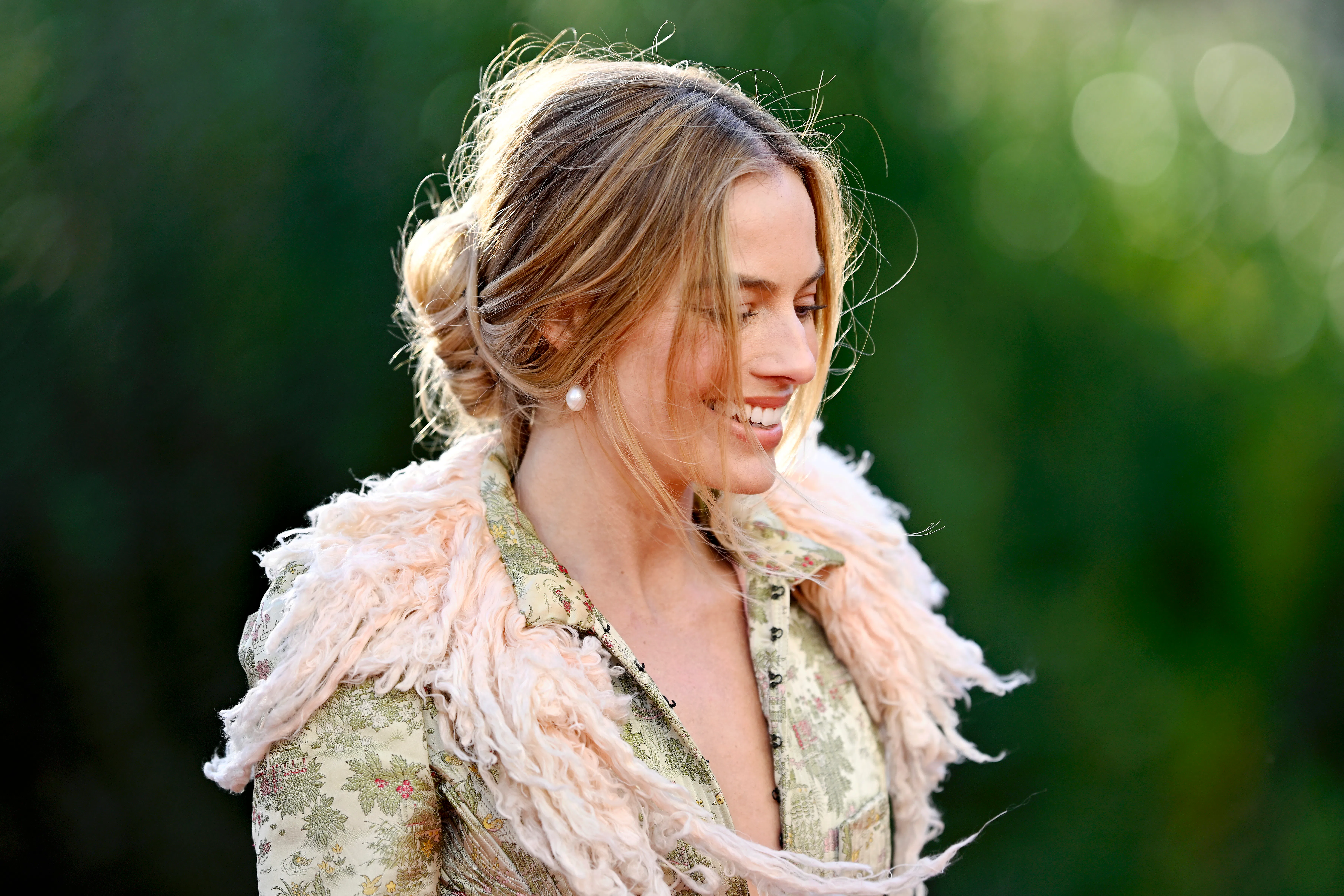 Margot Robbie wearing a tousled bun to promote "Wuthering Heights"