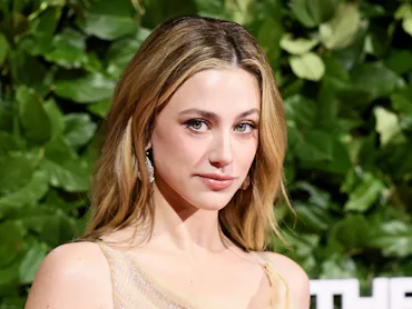 Lili Reinhart explained she had to wear a dress she disliked to the Oscars due to stylists not carry...