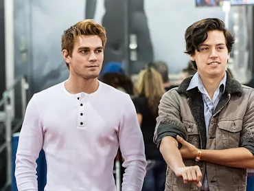 KJ Apa revealed Cole Sprouse once punched him in a strip club due to his drug use.