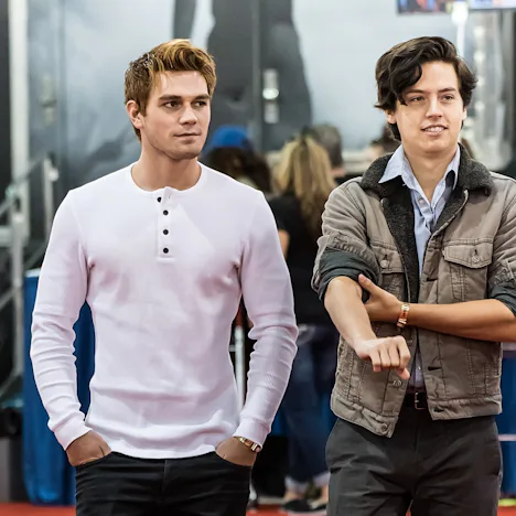 KJ Apa revealed Cole Sprouse once punched him in a strip club due to his drug use.