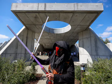 Orlando, Fla - March 01: Chuck Oehrlein of Helena Alabama, poses as Darth Revan, as the first passen...