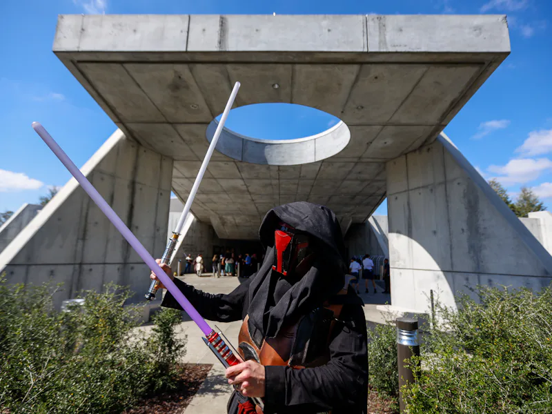 Orlando, Fla - March 01: Chuck Oehrlein of Helena Alabama, poses as Darth Revan, as the first passen...