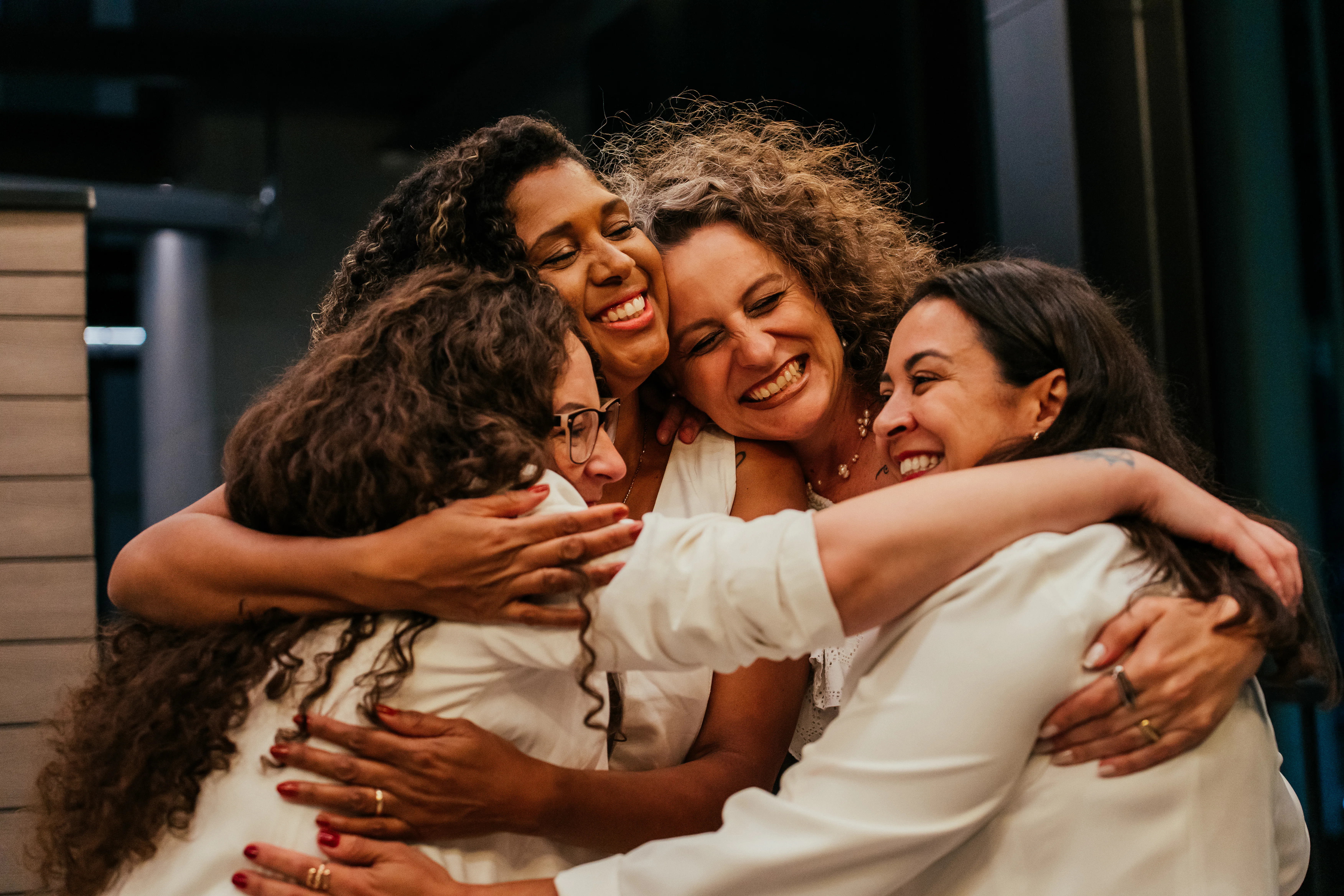 Female friends hugging each other on New Year's Eve