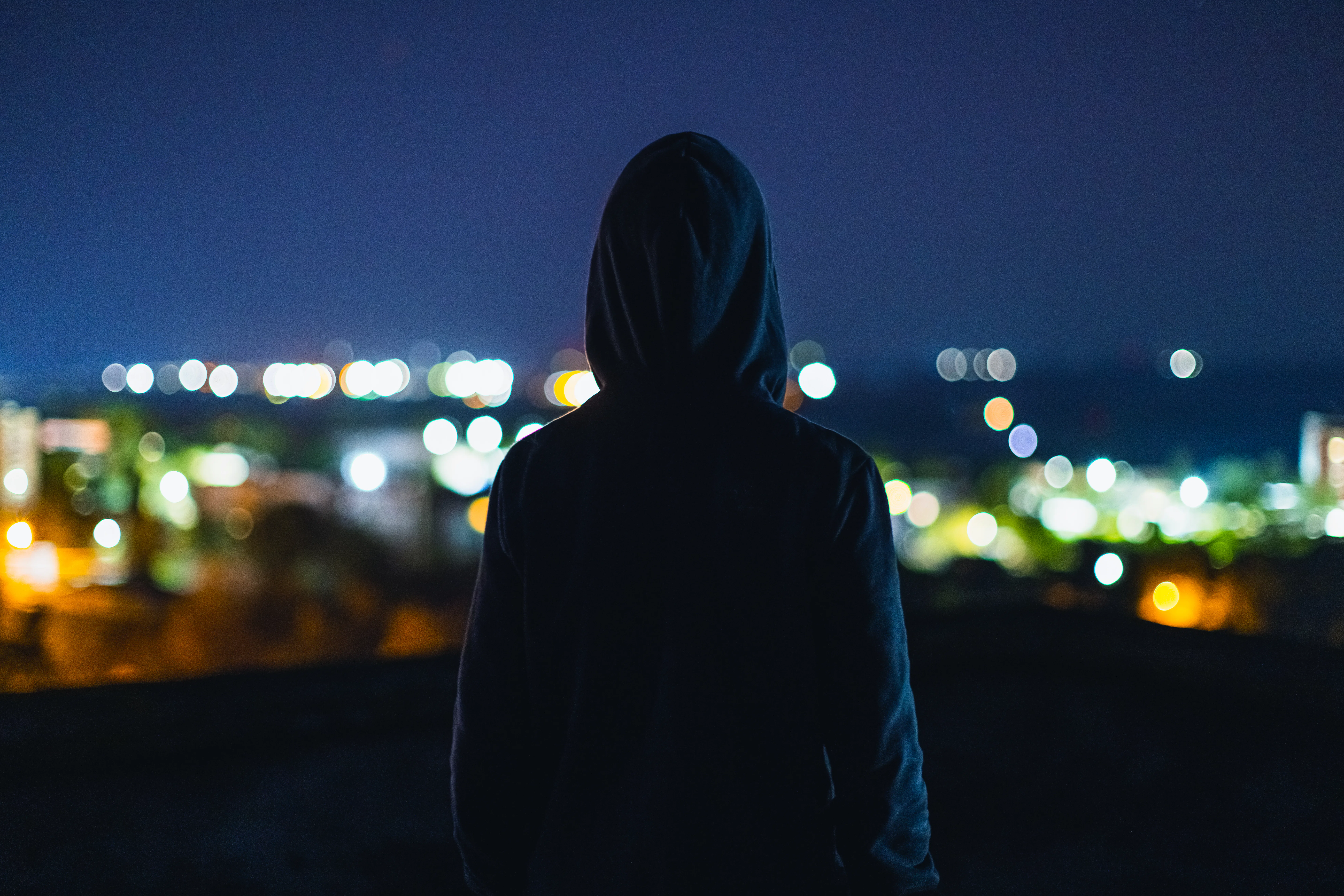Man silhouette at night city background