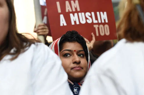 TOPSHOT - Protesters march in New York's Times Square in solidarity with American Muslims and agains...