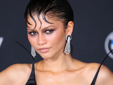 Zendaya with sleek gelled bangs on her forehead at a Spider-Man premiere