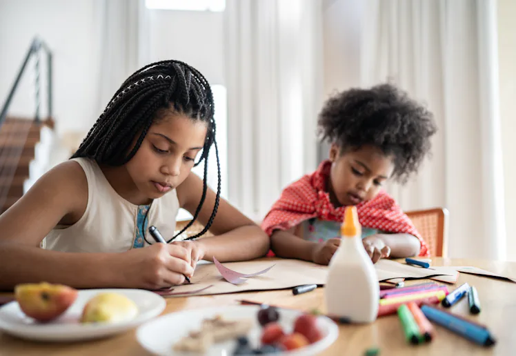 Sisters preparing costume, drawing and doing art and craft at home