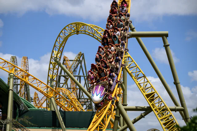 Guests ride the Stardust Racers rollercoaster in the Celestial Park area, at the Epic Universe theme...