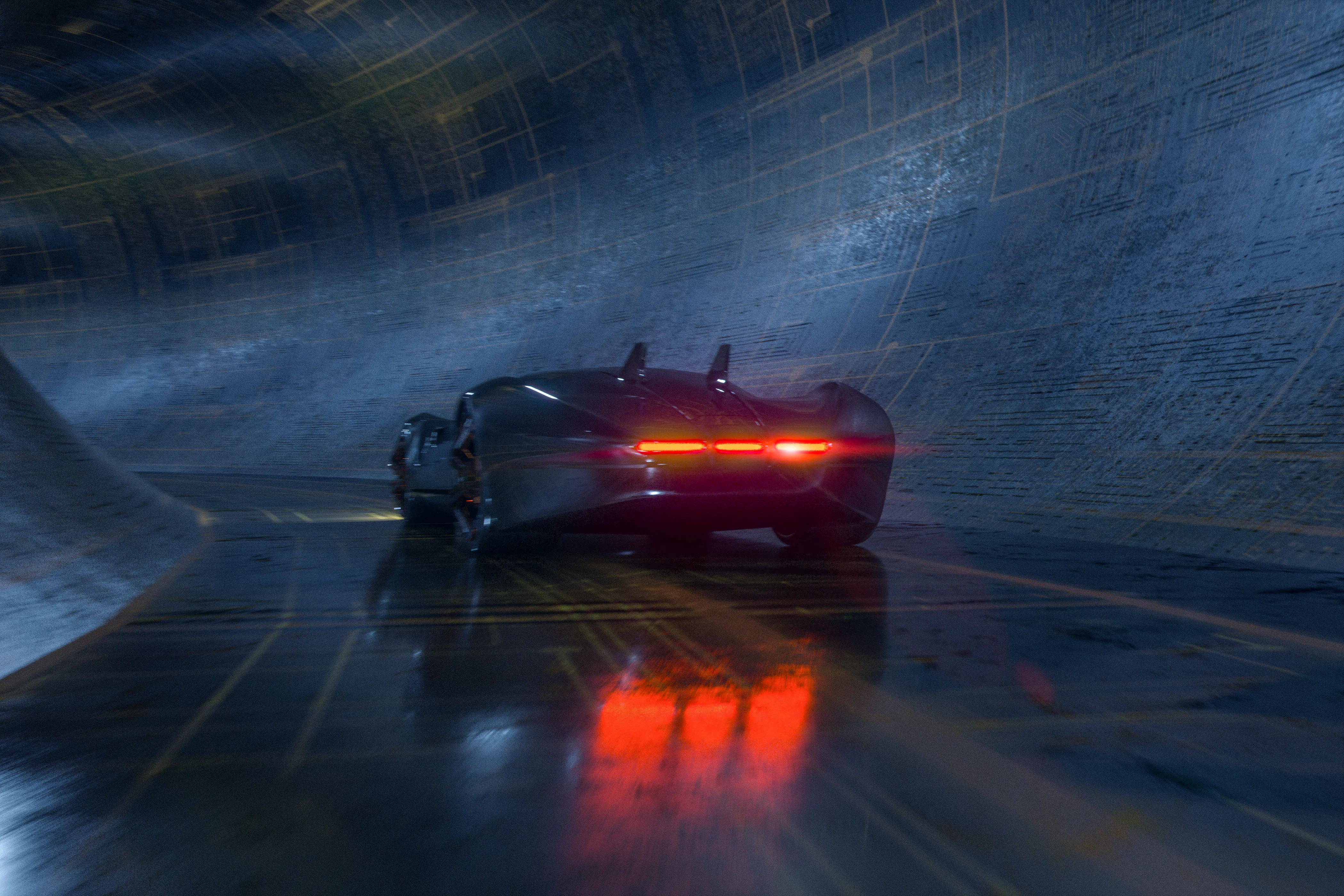 Generic futuristic sports car speeding in the underground tunnel. Vehicle design is not based on any...