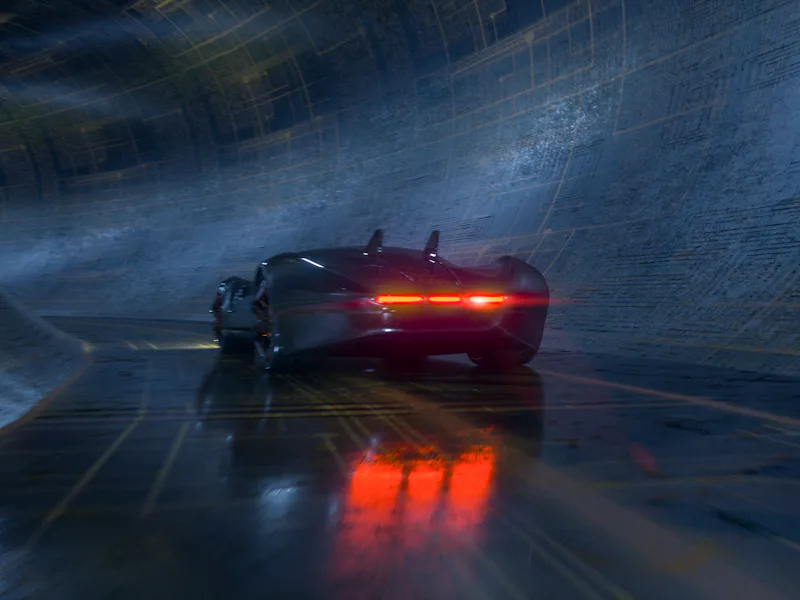 Generic futuristic sports car speeding in the underground tunnel. Vehicle design is not based on any...