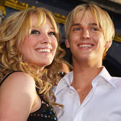 HOLLYWOOD, CA - APRIL 26: Actress Hilary Duff (L) hugs singer Aaron Carter as they attend the premie...
