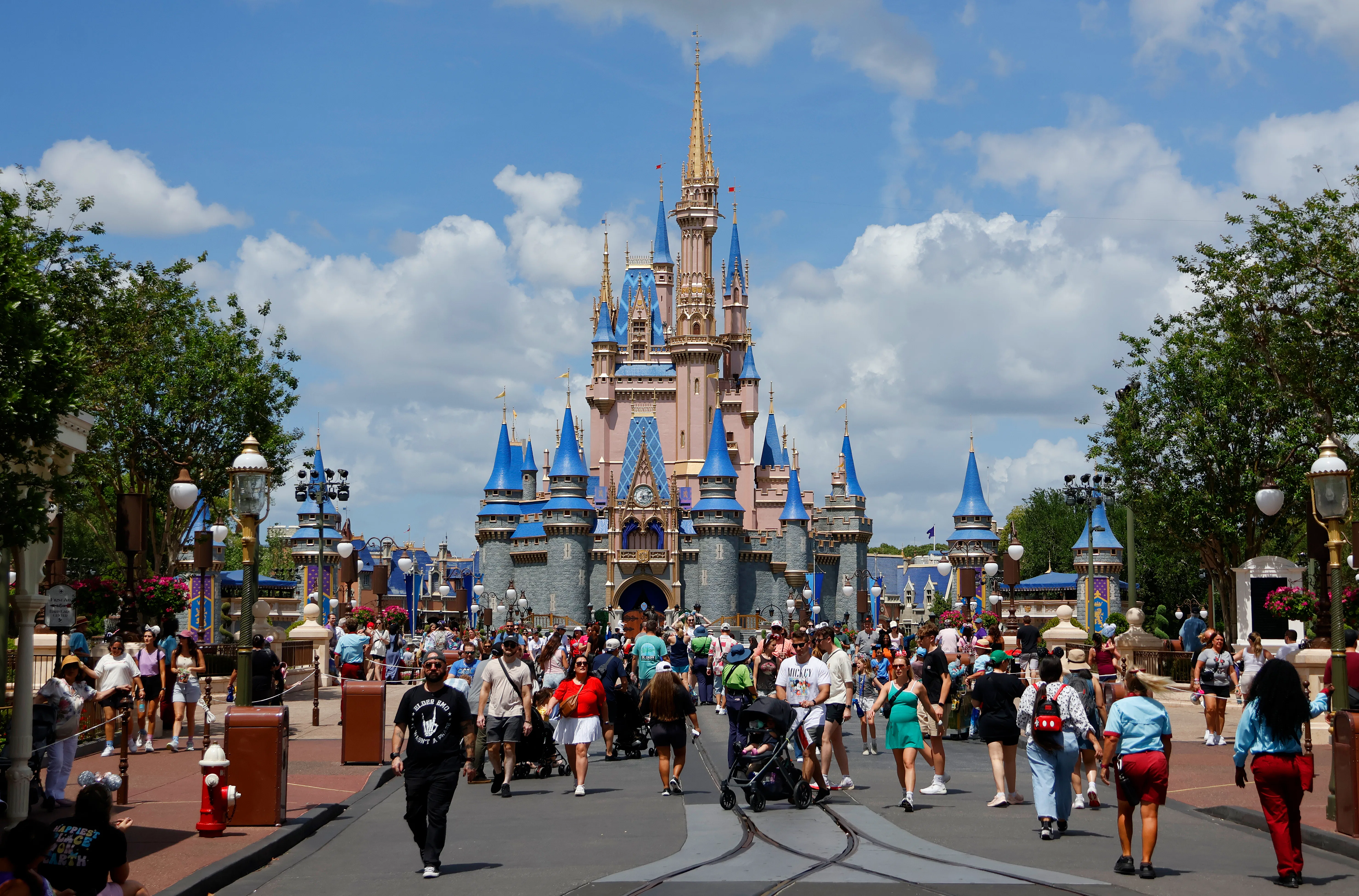 ORLANDO, FL - APRIL 3: People walk past the front of Cinderella's Castle at the Magic Kingdom Park a...