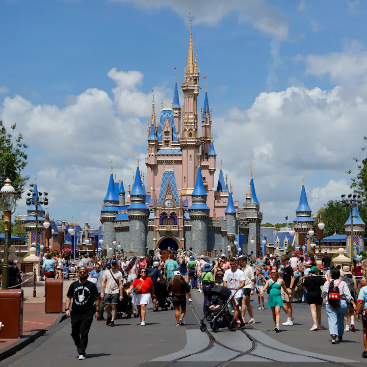 ORLANDO, FL - APRIL 3: People walk past the front of Cinderella's Castle at the Magic Kingdom Park a...