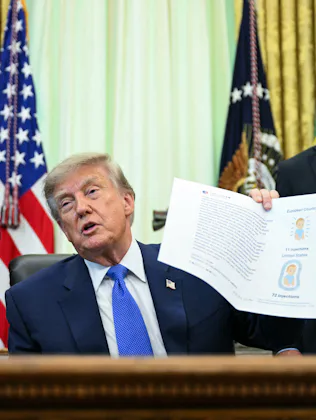 US Secretary of Health and Human Services Robert F. Kennedy Jr. (R) looks on as President Donald Tru...