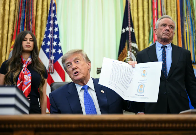 US Secretary of Health and Human Services Robert F. Kennedy Jr. (R) looks on as President Donald Tru...