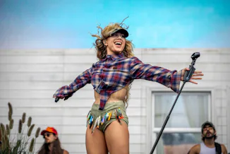 Slayyyter's Lollapalooza 2026 success mirrors Chappell Roan's massive crowd in 2024.