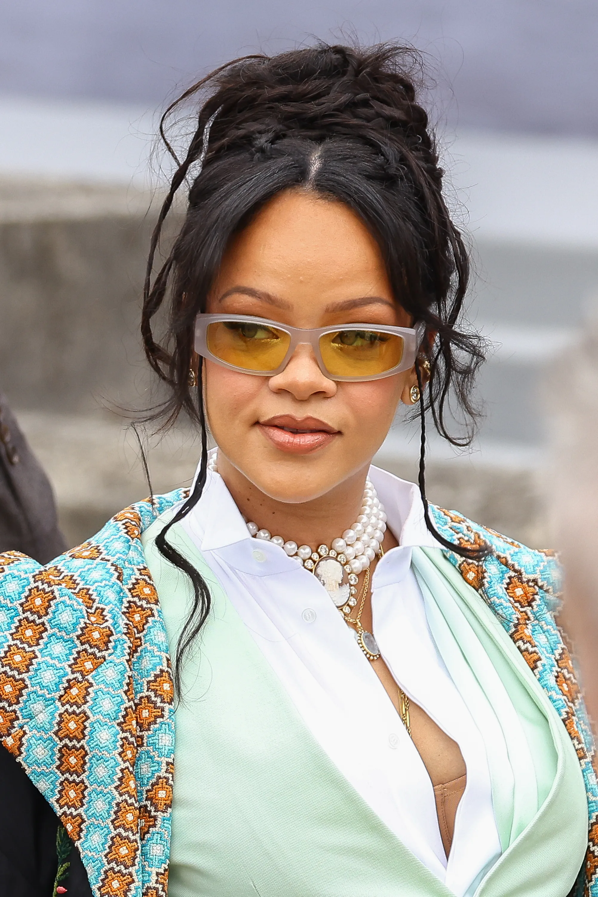 Rihanna at the Dior Homme Menswear Spring/Summer 2026 show in sunglasses and an updo
