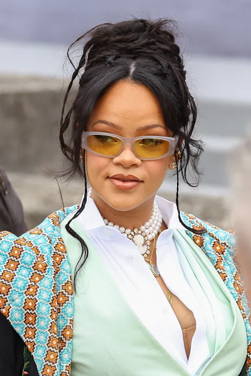 Rihanna at the Dior Homme Menswear Spring/Summer 2026 show in sunglasses and an updo