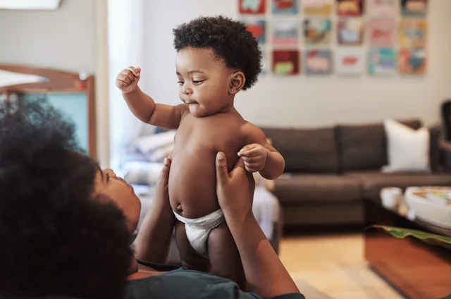 Shot of an adorable baby girl bonding with her mother at home