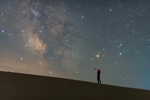 Astrophotography captured at the desert in Kulun Banner, Tongliao, Inner Mongolia, China. A silhouet...