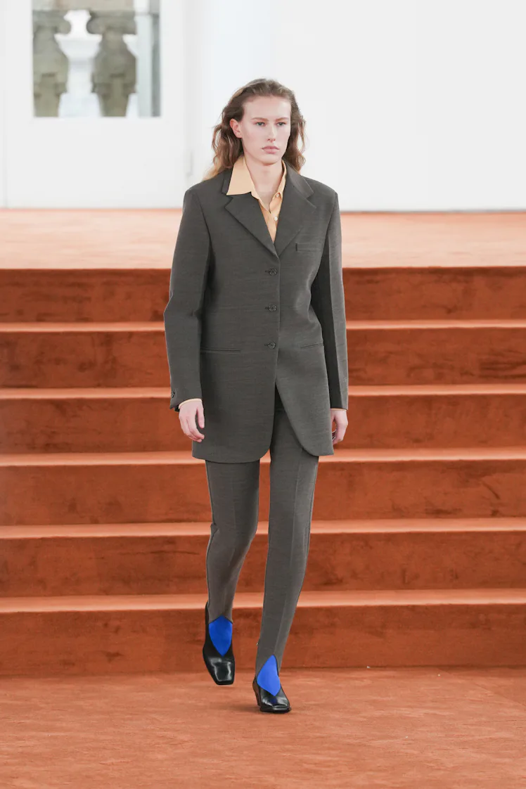 MILAN, ITALY - FEBRUARY 25: A model walks the runway at the Jil Sander fashion show during the Milan...