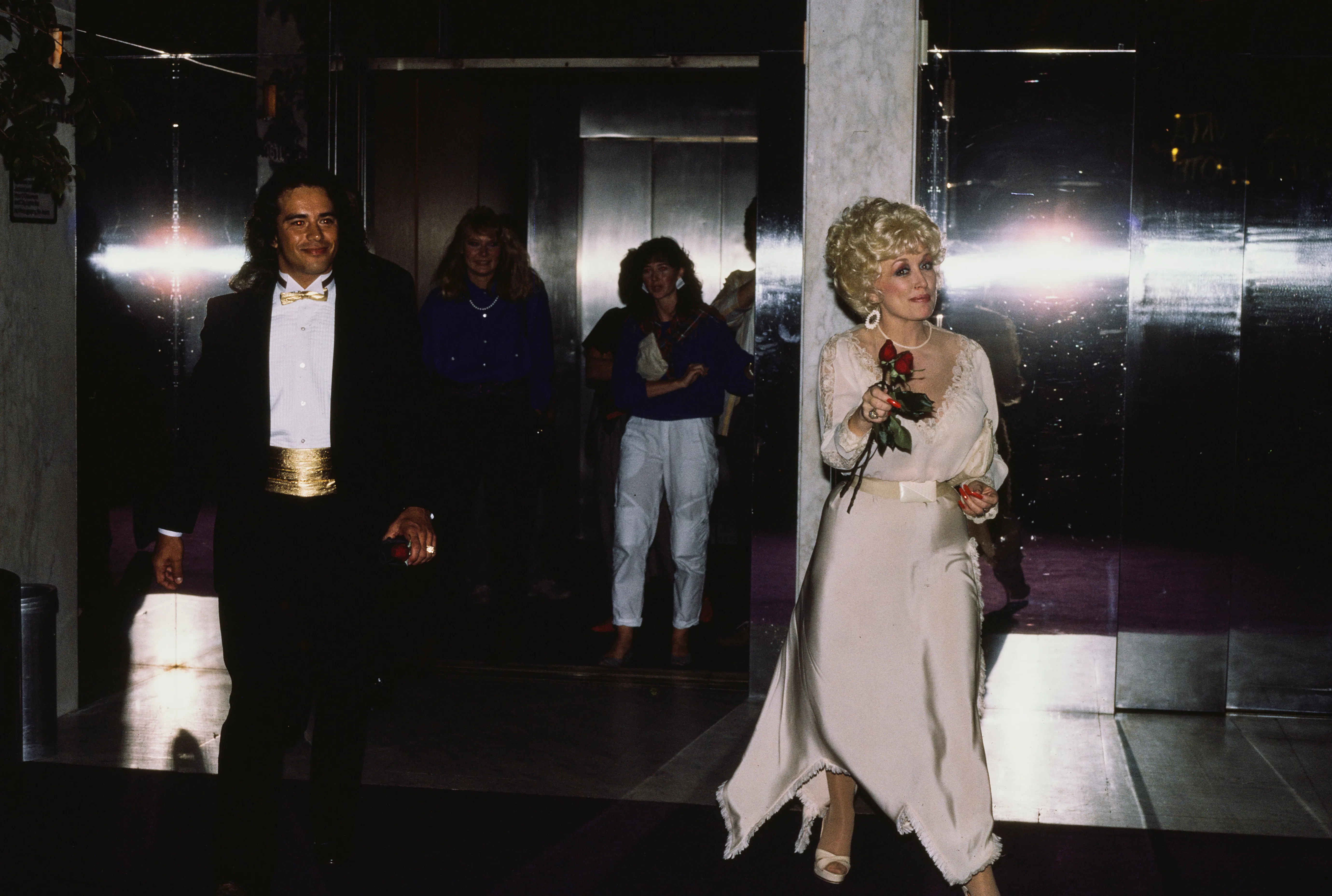 Dolly Parton with an unidentified man in New York City, New York, United States, circa 1990s. (Photo...
