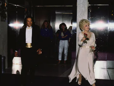 Dolly Parton with an unidentified man in New York City, New York, United States, circa 1990s. (Photo...