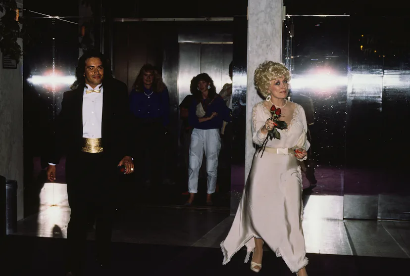 Dolly Parton with an unidentified man in New York City, New York, United States, circa 1990s. (Photo...