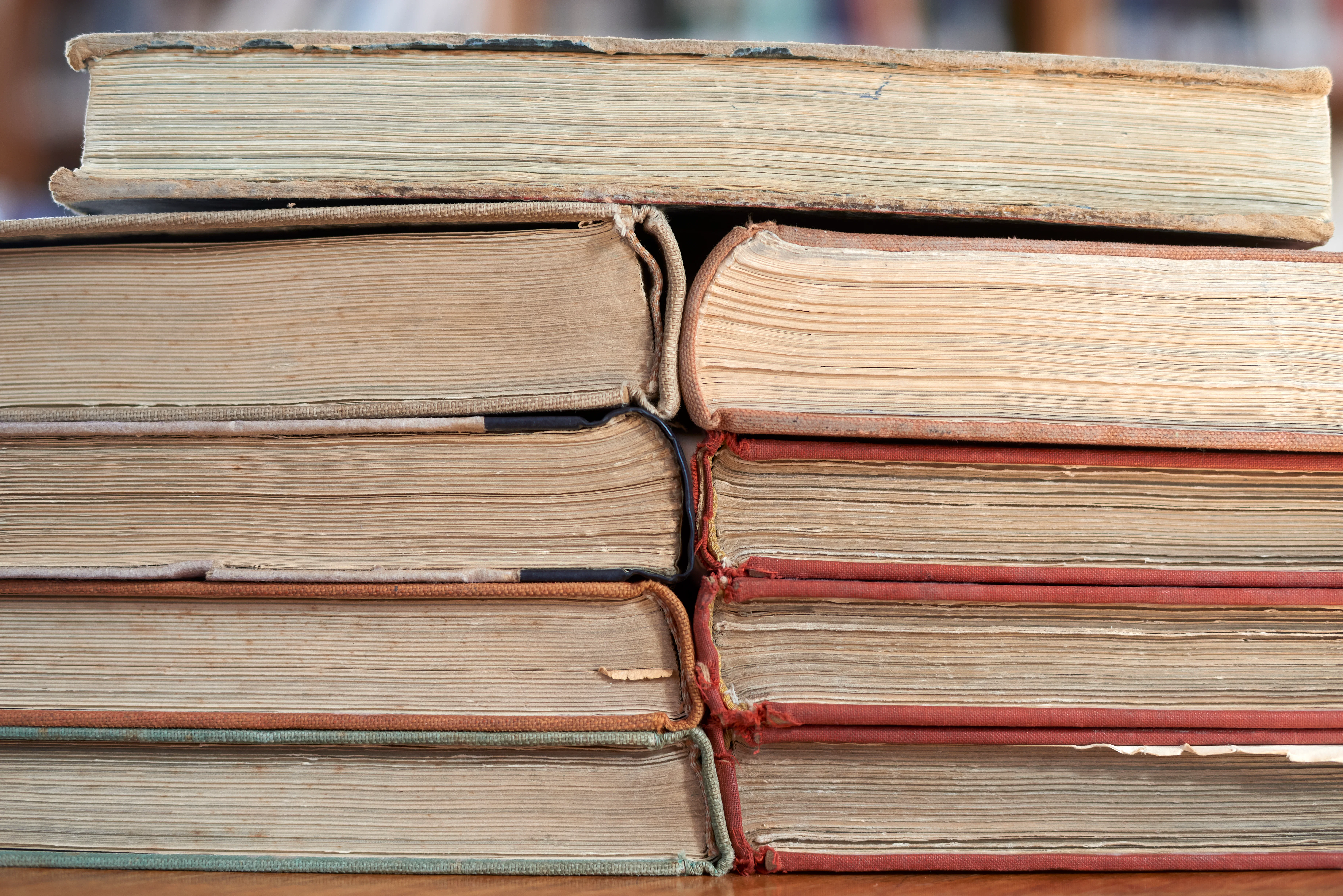 Stacked old books with worn pages and covers symbolize knowledge, learning, literature, history, edu...