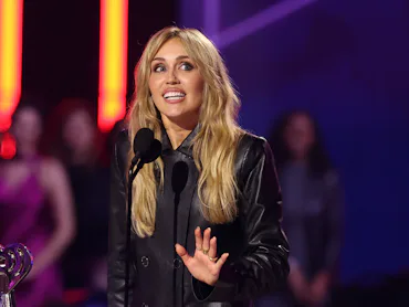 HOLLYWOOD, CALIFORNIA - MARCH 26: Miley Cyrus accepts the Innovator Award onstage during the 2026 iH...