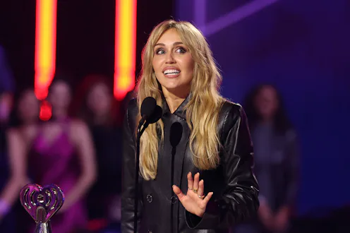 HOLLYWOOD, CALIFORNIA - MARCH 26: Miley Cyrus accepts the Innovator Award onstage during the 2026 iH...
