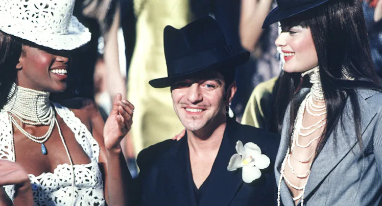 PARIS, FRANCE - JANUARY 20: Fashion designer John Galliano and Naomi Campbell walk the runway during...