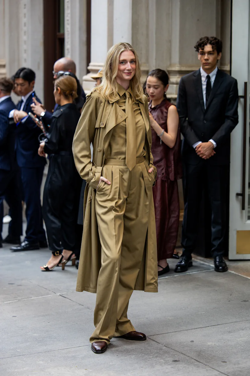 NEW YORK, NEW YORK - SEPTEMBER 09: Elizabeth Debicki wears beige shirt, tie, coat, pants outside Ral...
